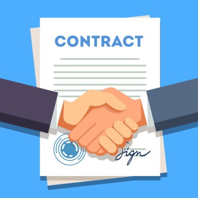 Business man shaking hands over a signed contract